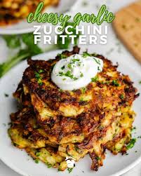 These zucchini fritters are golden, crispy, and the perfect way to turn  that pile of summer squash into something snackable. Quick to mix, easy to  fry, and even better with a dollop