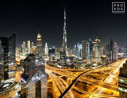 View of Burj Khalifa and Dubai Skyline at Night - Framed Photo by Andrew  Prokos