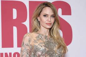 Angelina Jolie Stuns Pairing Bold Red Lip With White Satin Wrap Dress
