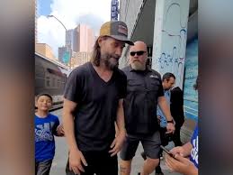 Watch: Keanu Reeves plays catch with young fan before Dogstar concert